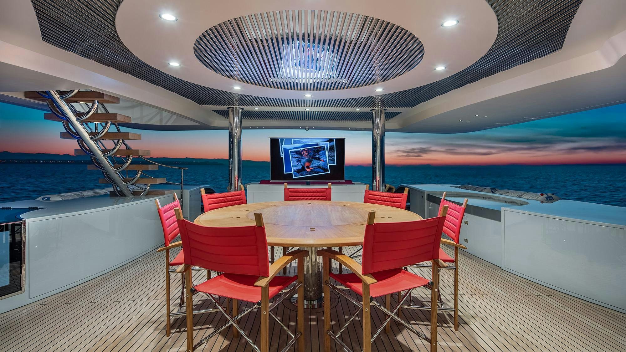 a table and chairs on a boat aboard EUPHORIA II Yacht for Charter