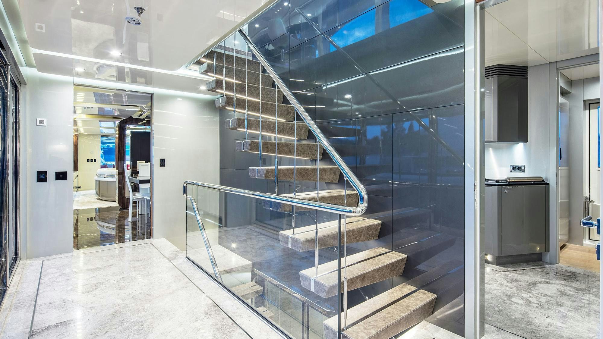 a large room with stairs aboard EUPHORIA II Yacht for Charter