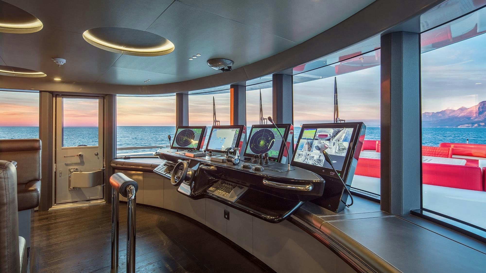 a room with a table and chairs aboard EUPHORIA II Yacht for Charter