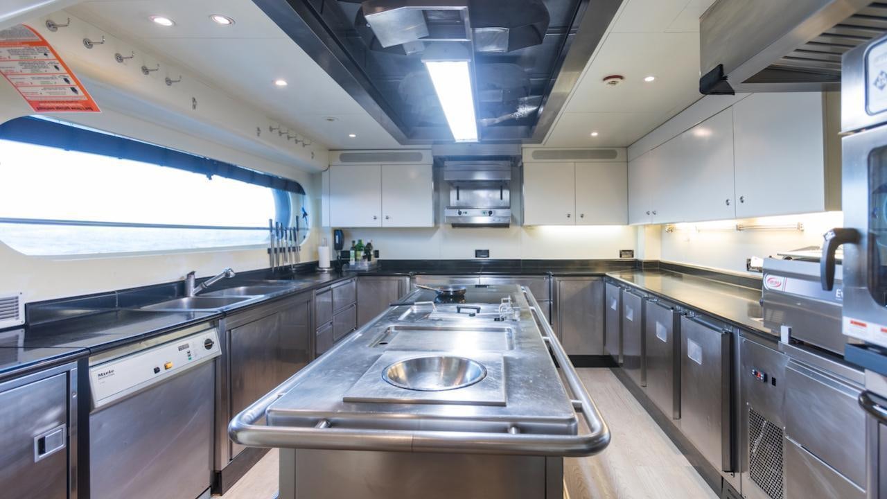 a kitchen with a stainless steel sink aboard BARENTS Yacht for Charter