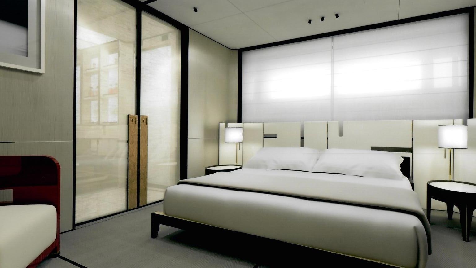 a room with a bed and a lamp aboard ENDEAVOUR 2 Yacht for Charter