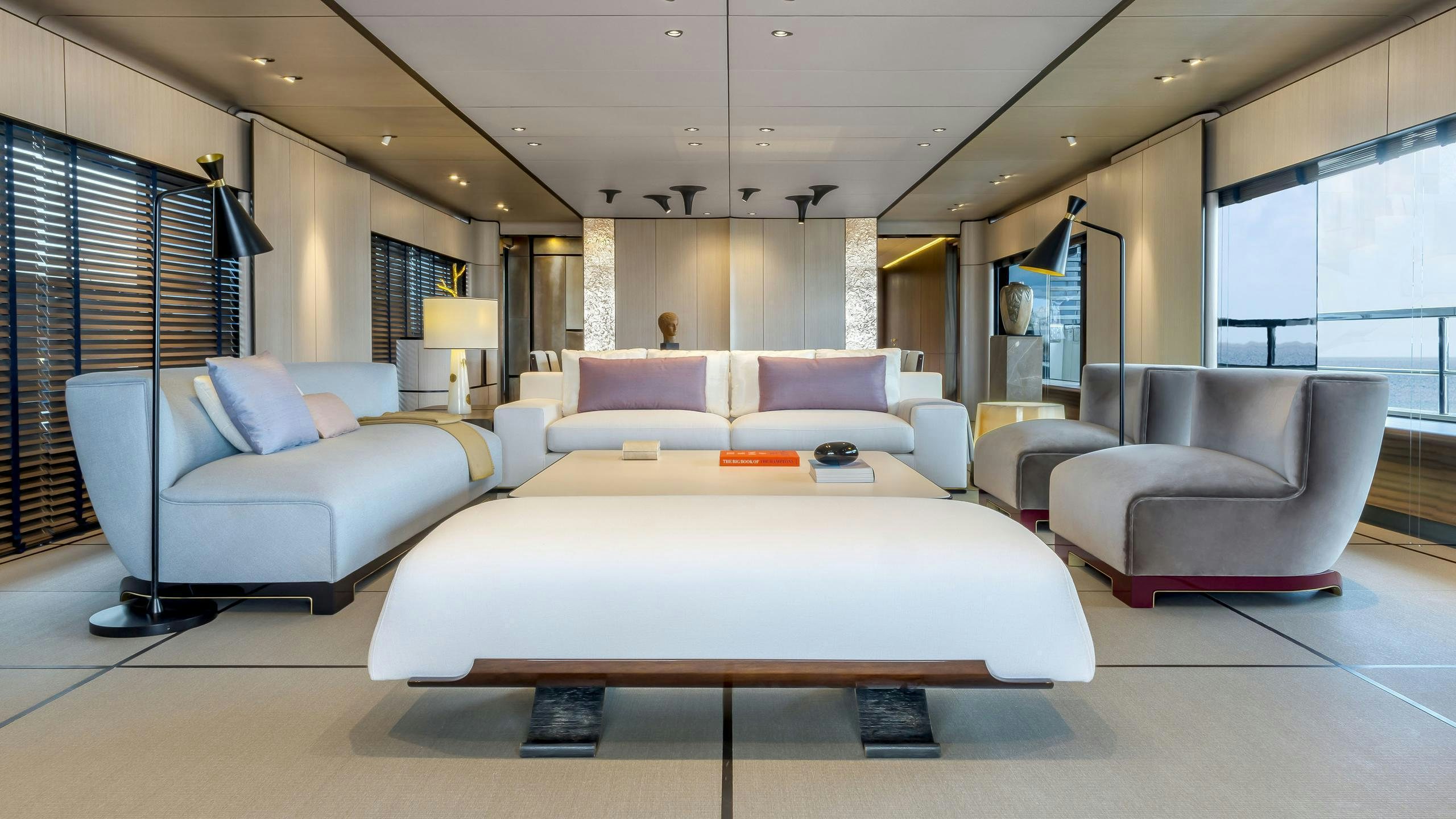 a room with a bed and a couch aboard ENDEAVOUR 2 Yacht for Charter