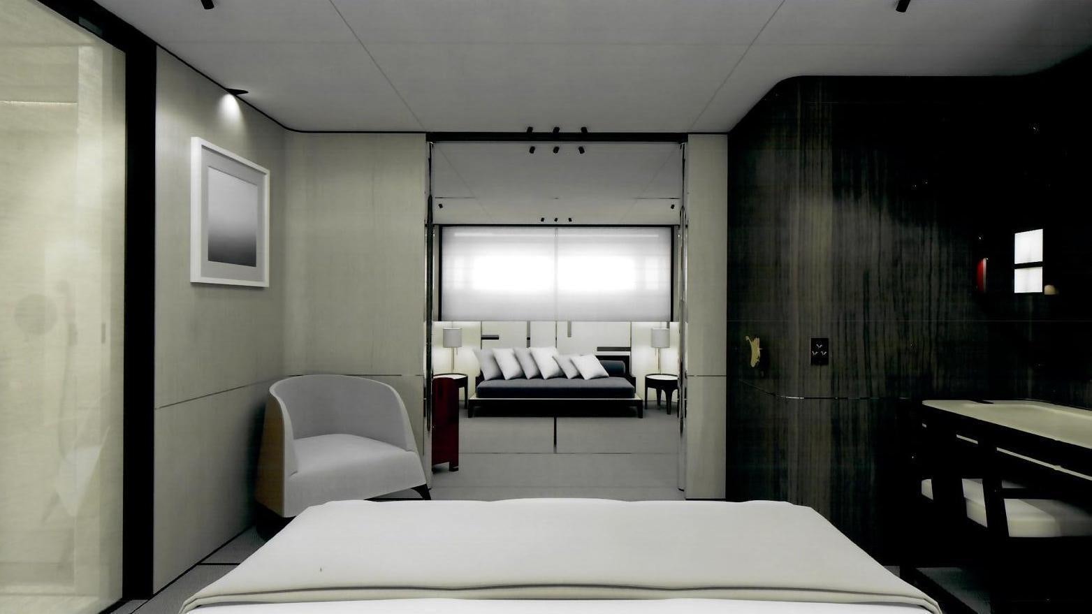 a room with a bed and a chair aboard ENDEAVOUR 2 Yacht for Charter