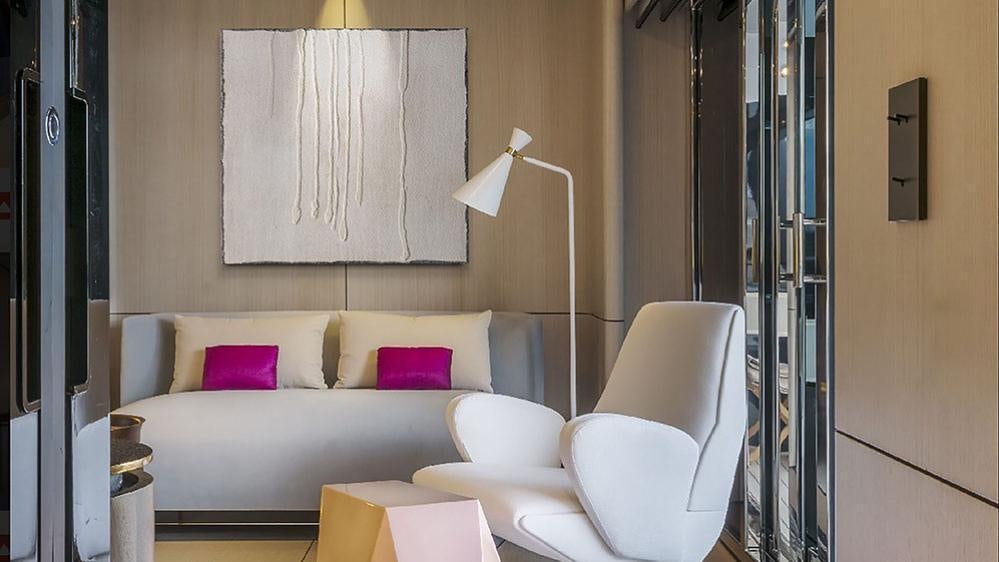 a room with a bed and a lamp aboard ENDEAVOUR 2 Yacht for Charter