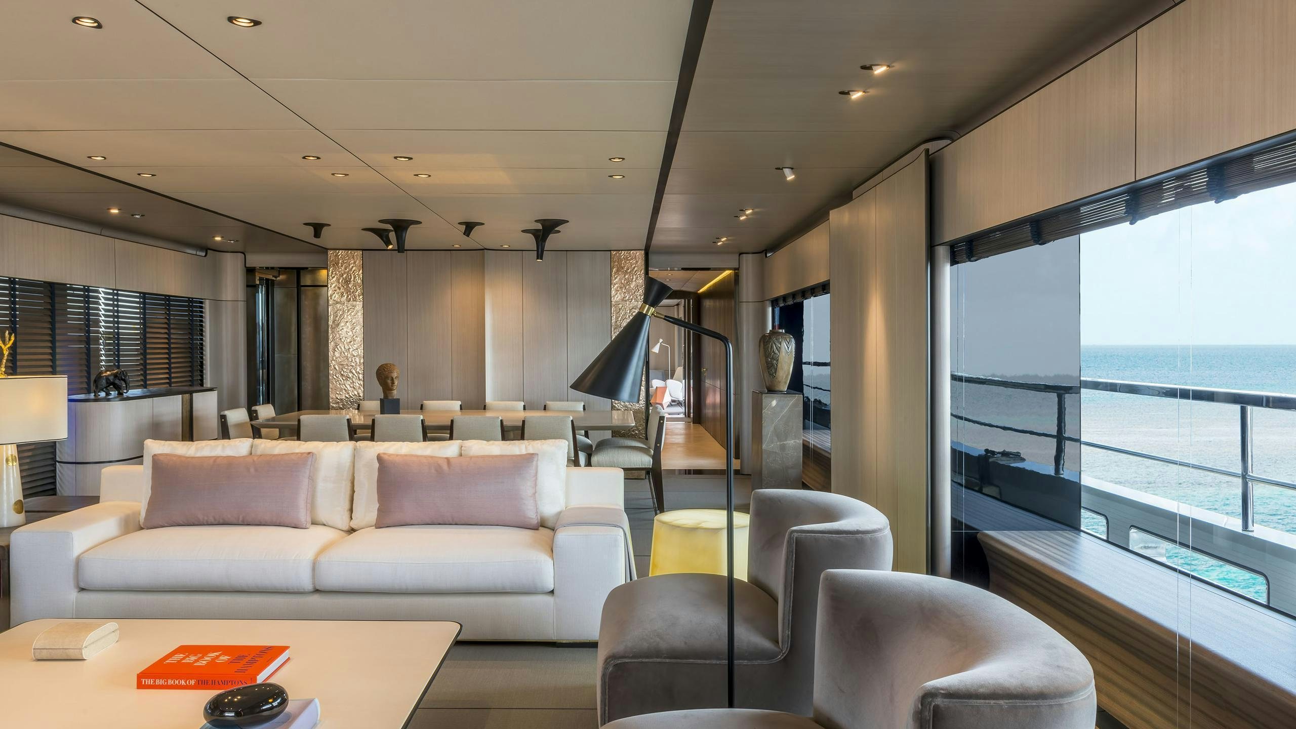 a living room with a large window aboard ENDEAVOUR 2 Yacht for Charter