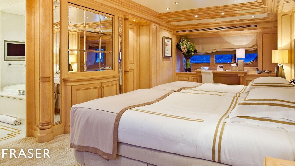 a bedroom with a large bed aboard ELENA V Yacht for Charter