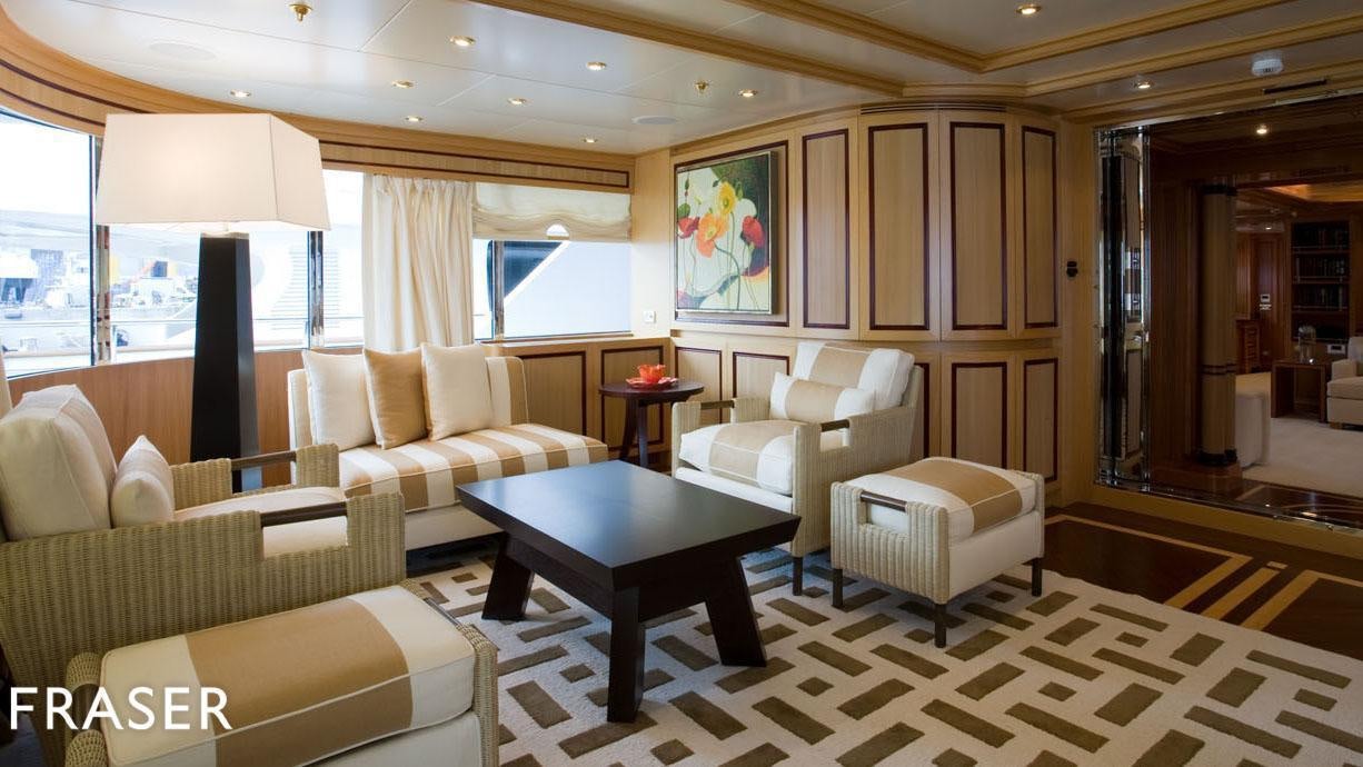 a living room with a table and chairs aboard ELENA V Yacht for Charter