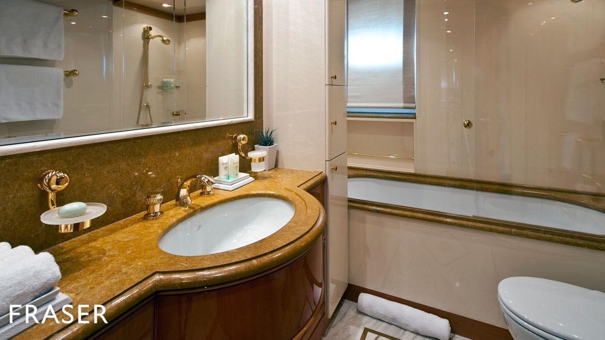 a bathroom with a sink and a bathtub aboard ELENA V Yacht for Charter