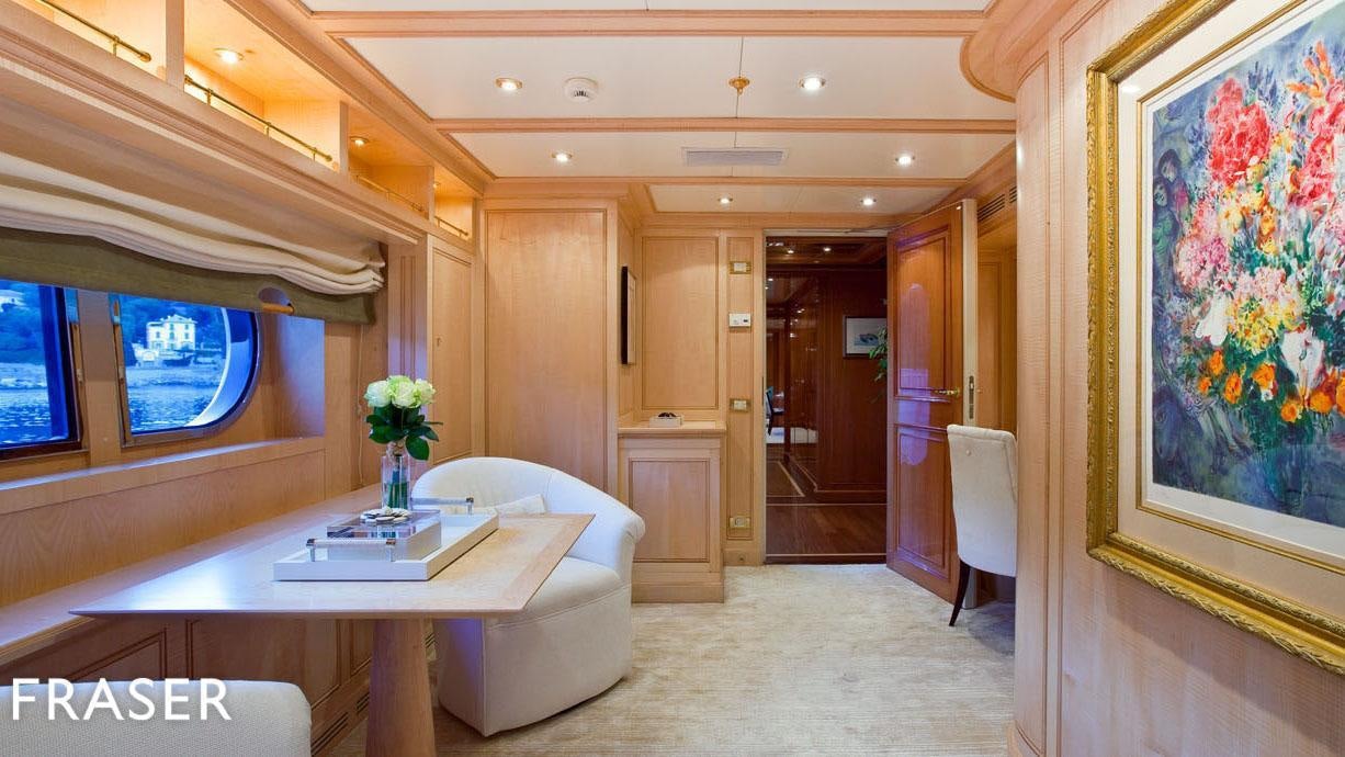 a room with a table and chairs aboard ELENA V Yacht for Charter