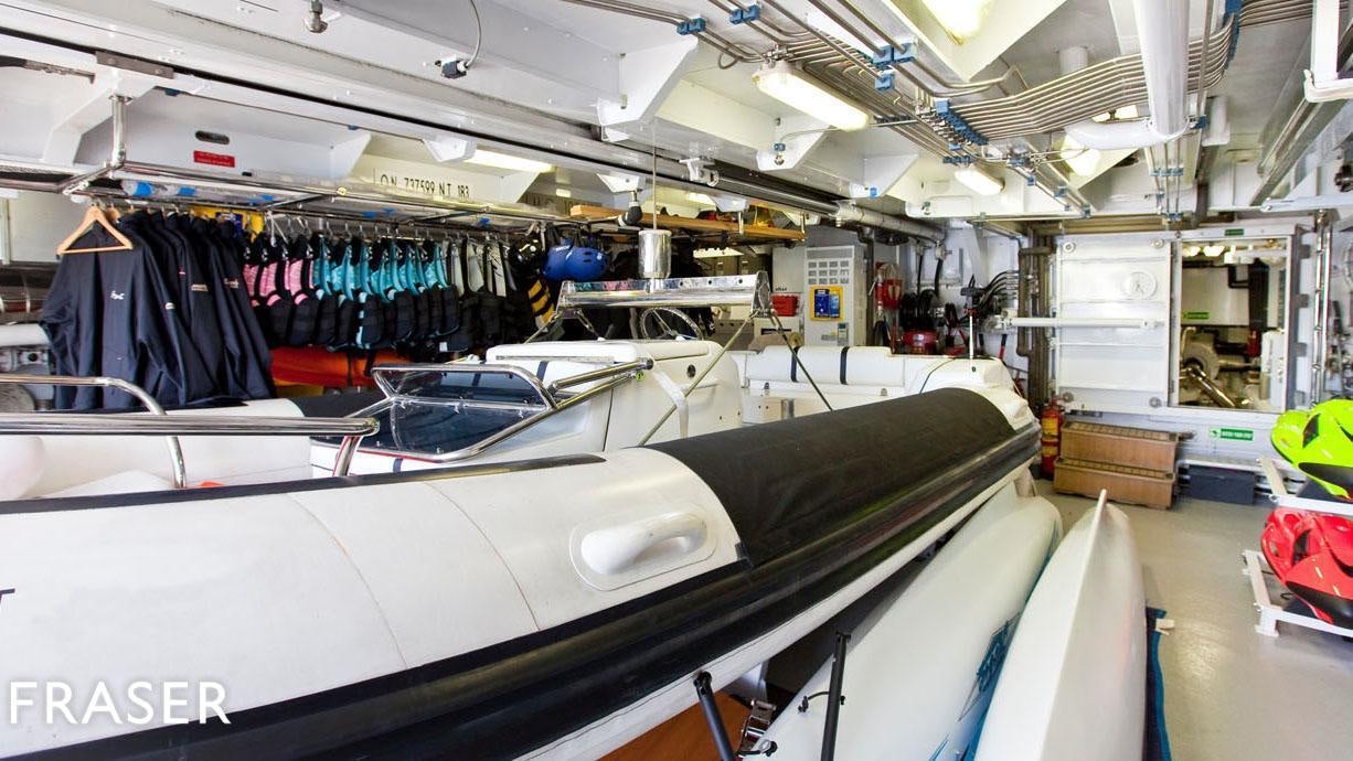 a car in a garage aboard ELENA V Yacht for Charter