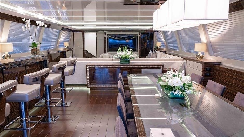 a large kitchen with a table and chairs aboard (DELETE)INCOGNITO Yacht for Charter