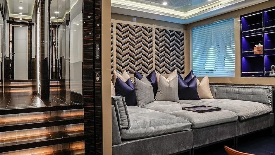 a couch in a room aboard (DELETE)INCOGNITO Yacht for Charter