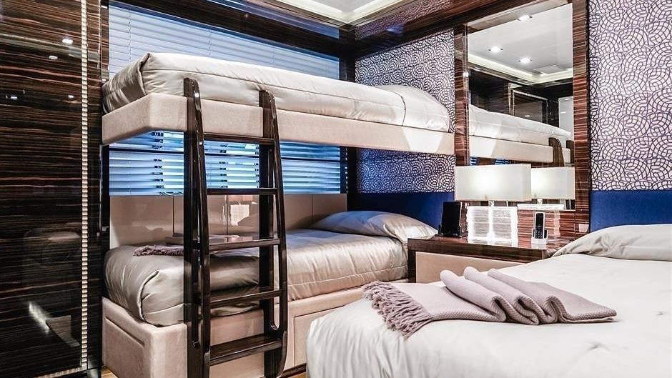 a bed with a wood frame aboard (DELETE)INCOGNITO Yacht for Charter