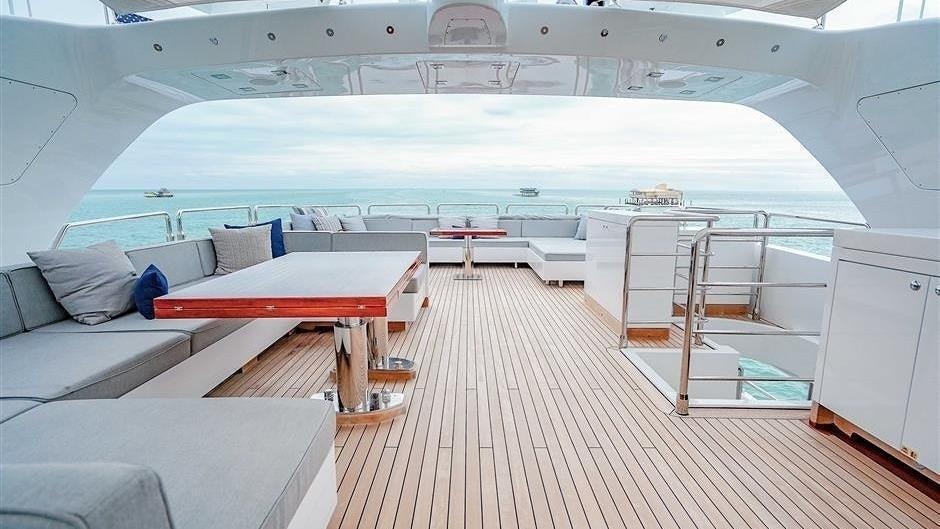 a large room with a couch and a table aboard (DELETE)INCOGNITO Yacht for Charter