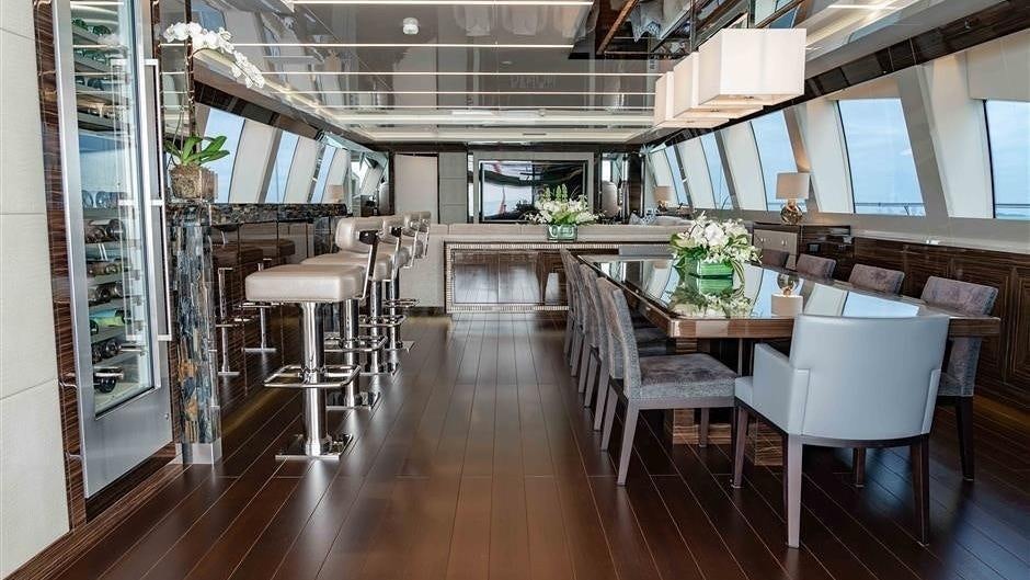 a room with tables and chairs aboard (DELETE)INCOGNITO Yacht for Charter