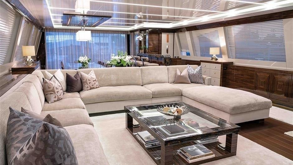 a living room with a couch and a coffee table aboard (DELETE)INCOGNITO Yacht for Charter