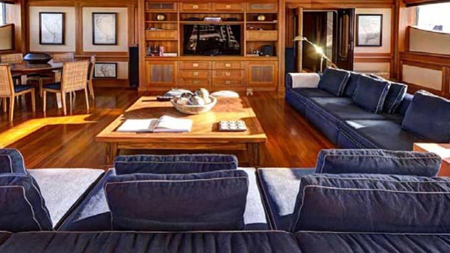 a living room with a couch and a coffee table aboard AZTECA Yacht for Charter
