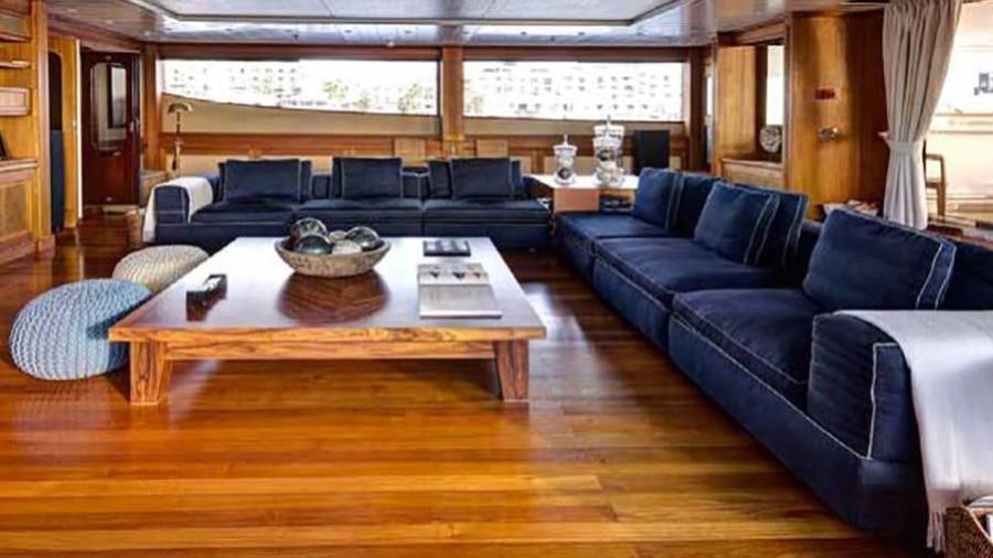 a living room with a couch and a table aboard AZTECA Yacht for Charter