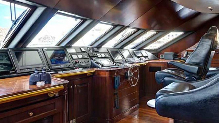 a room with a desk and chairs aboard AZTECA Yacht for Charter