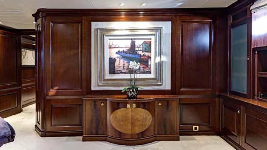 a wooden cabinet with a fish tank aboard AZTECA Yacht for Charter