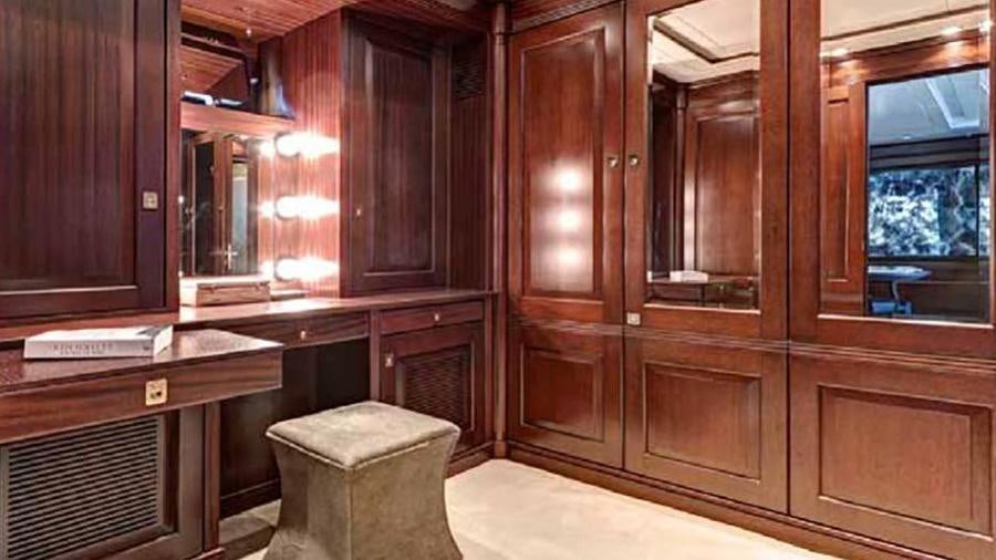 a room with wooden cabinets aboard AZTECA Yacht for Charter