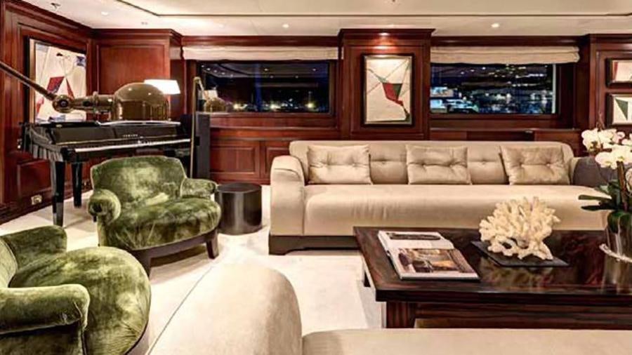 a living room with a couch and a coffee table aboard AZTECA Yacht for Charter