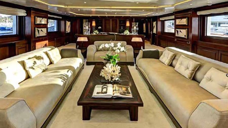 a living room with a couch and a coffee table aboard AZTECA Yacht for Charter