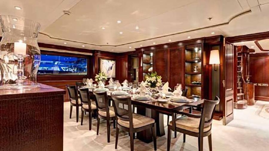 a dining room with a table and chairs aboard AZTECA Yacht for Charter