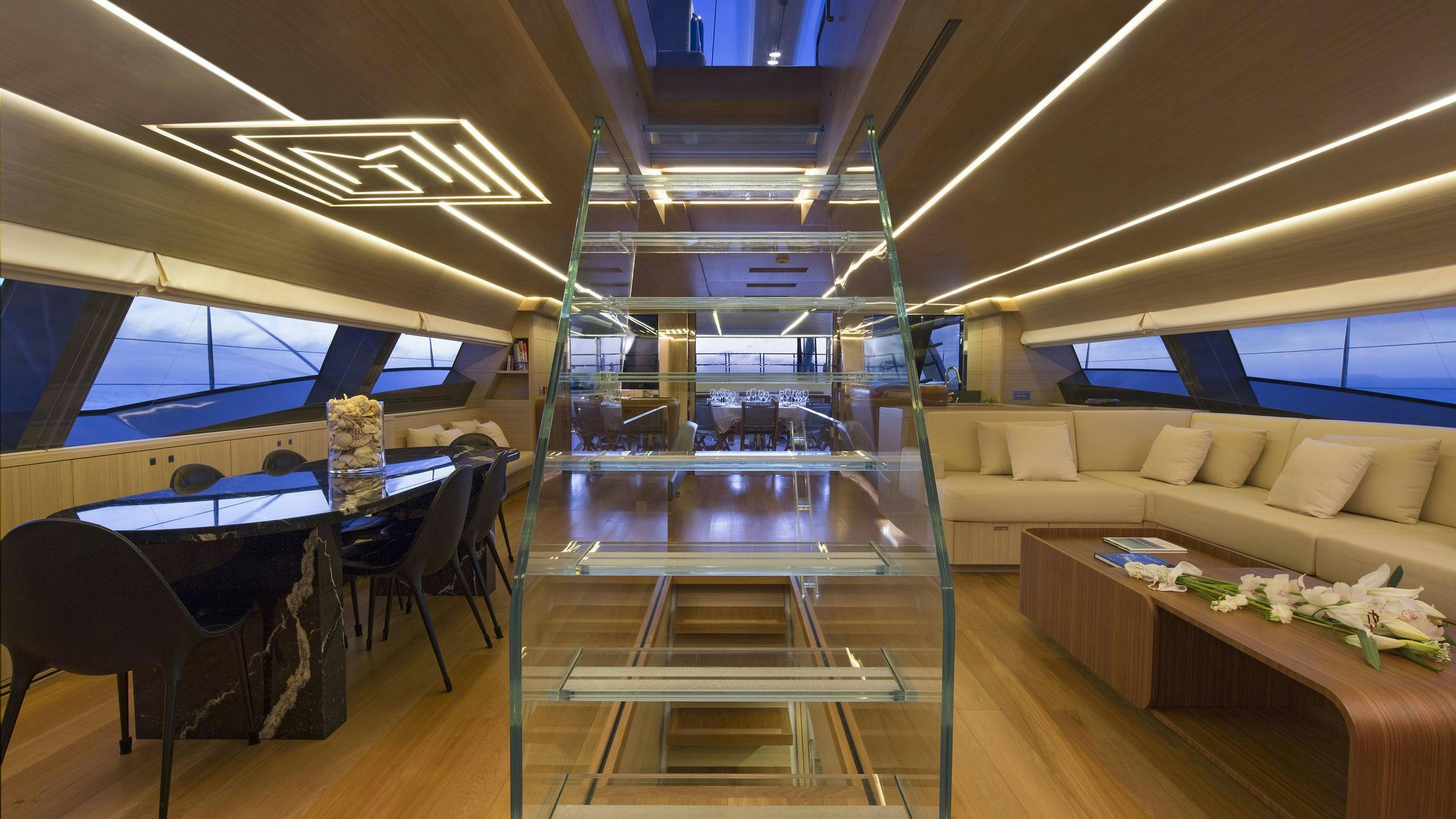 a room with a couch and a table aboard OHANA Yacht for Charter