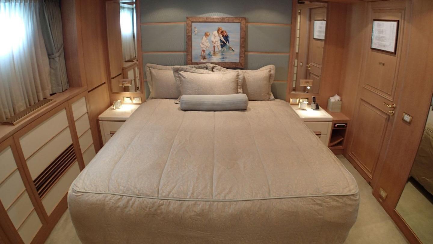 a bed in a room aboard TE MANU Yacht for Charter