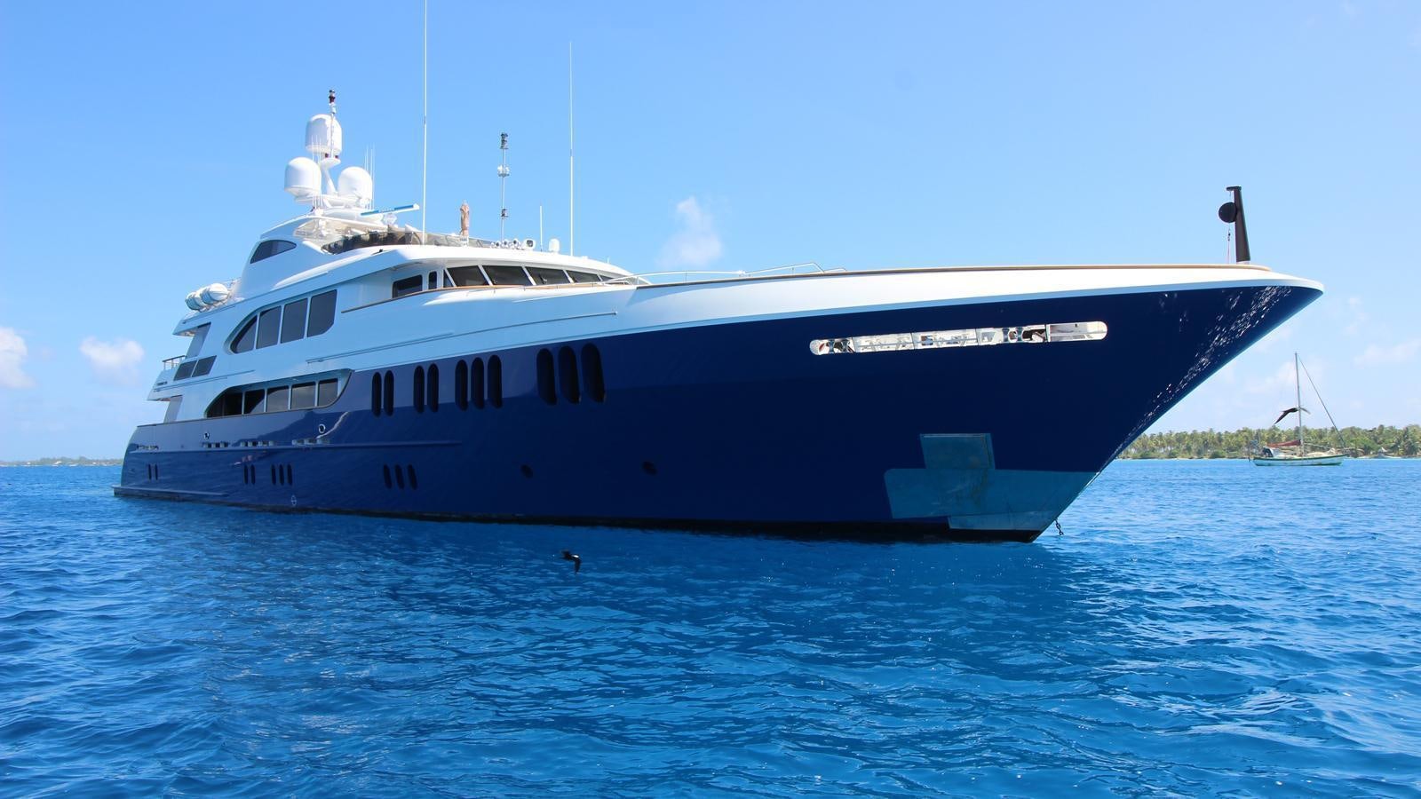 a large white boat in the water aboard LA DEA II Yacht for Charter