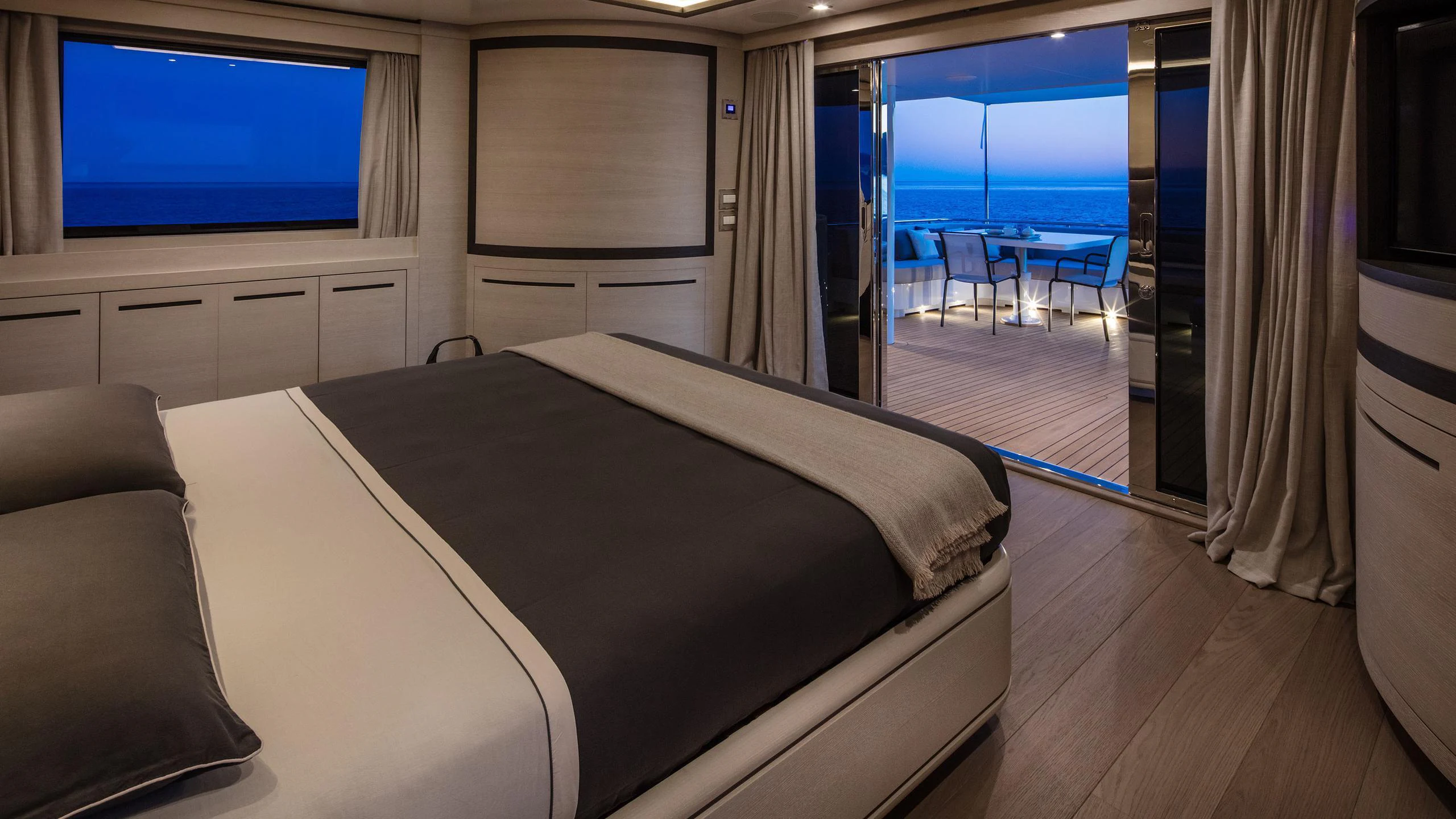 a room with a bed and a tv on the wall aboard ALALYA Yacht for Charter