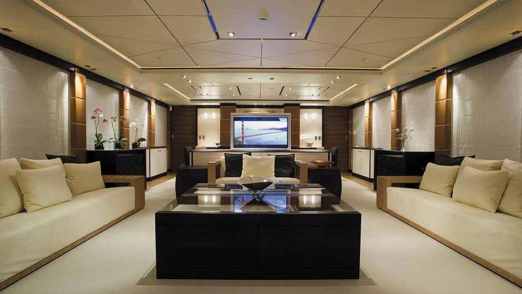 a living room with a large screen aboard ALALYA Yacht for Charter