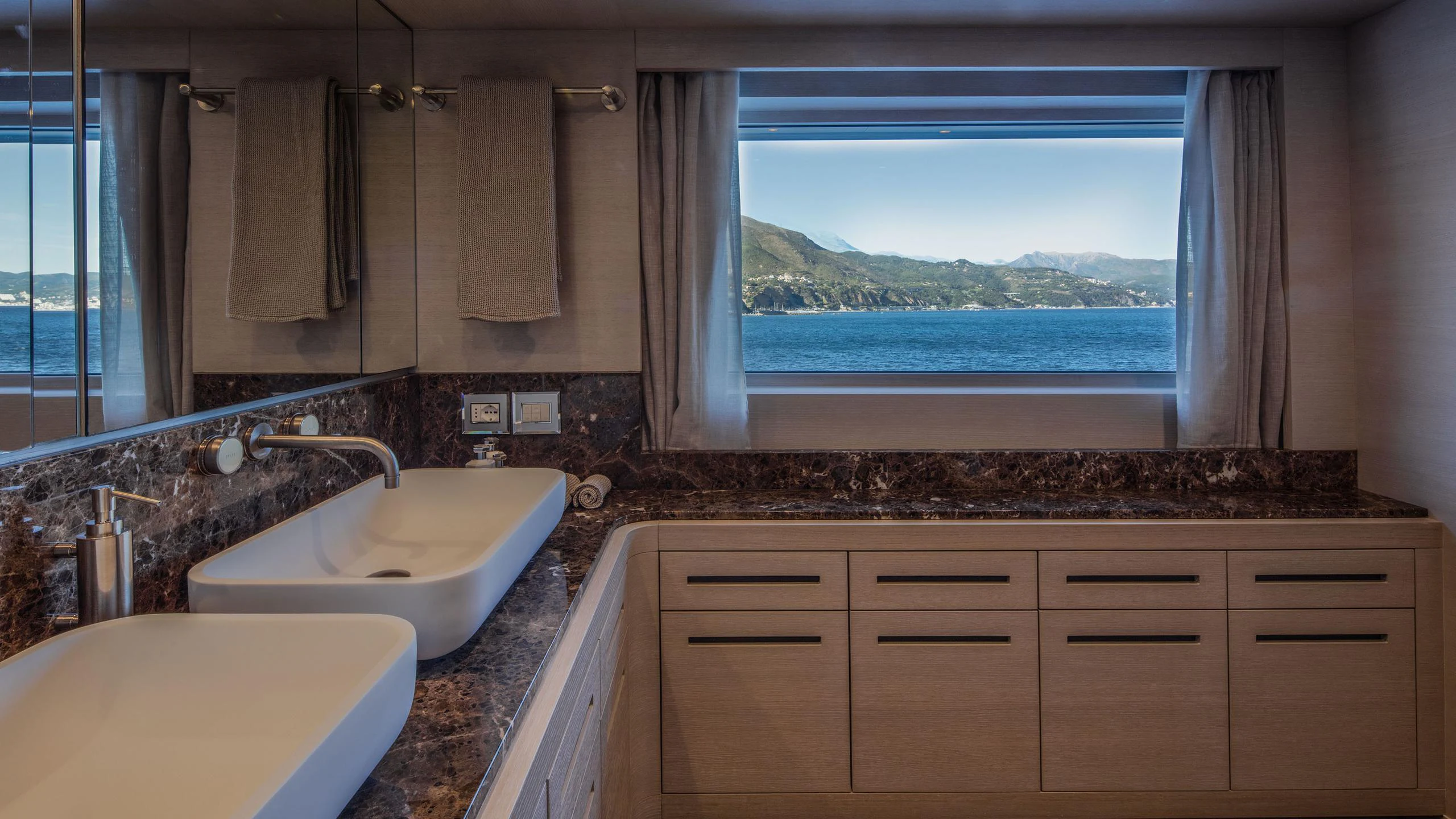 a bathroom with a large window aboard ALALYA Yacht for Charter