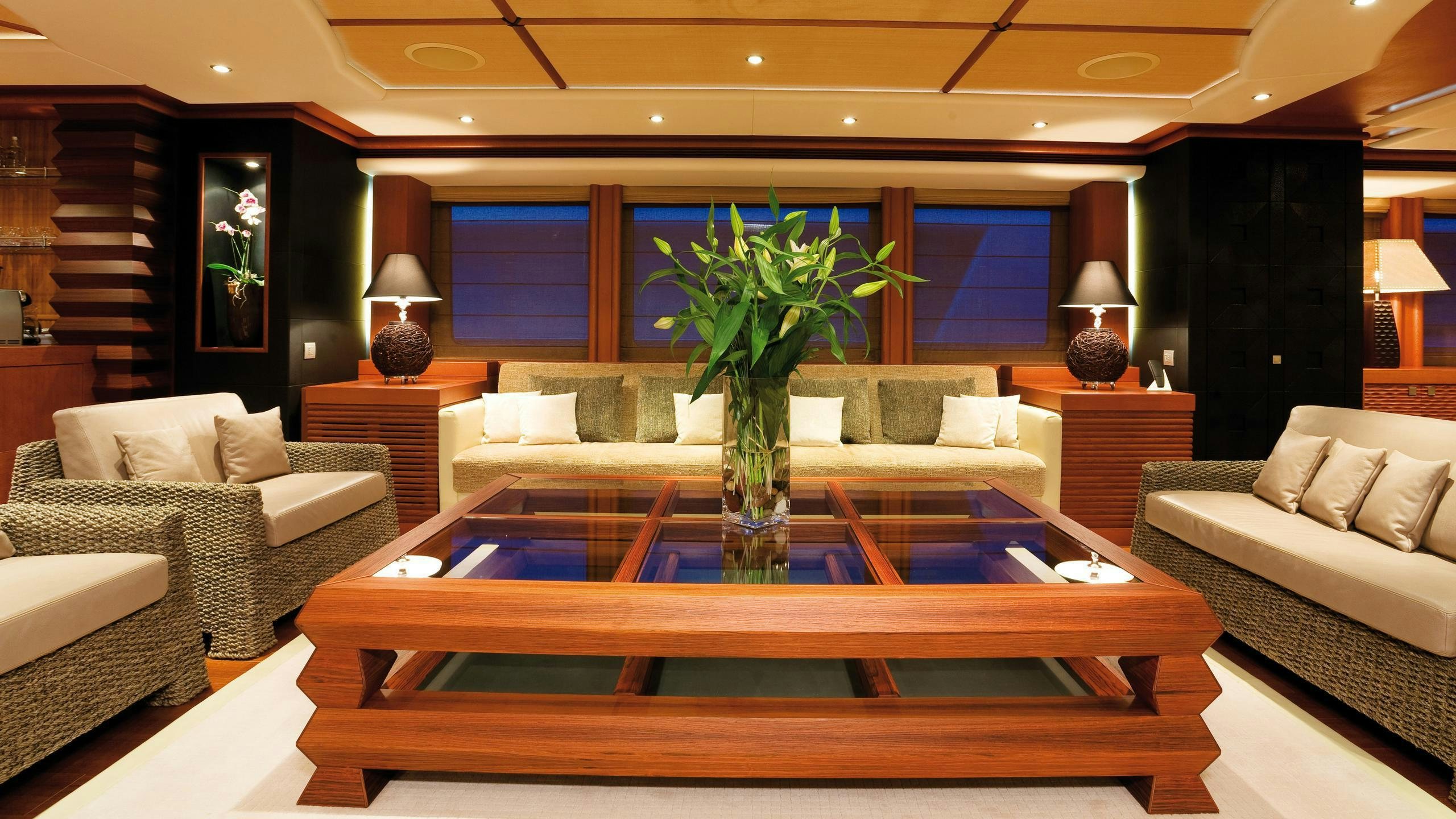 a living room with a large coffee table and a couch aboard SIROCCO Yacht for Charter