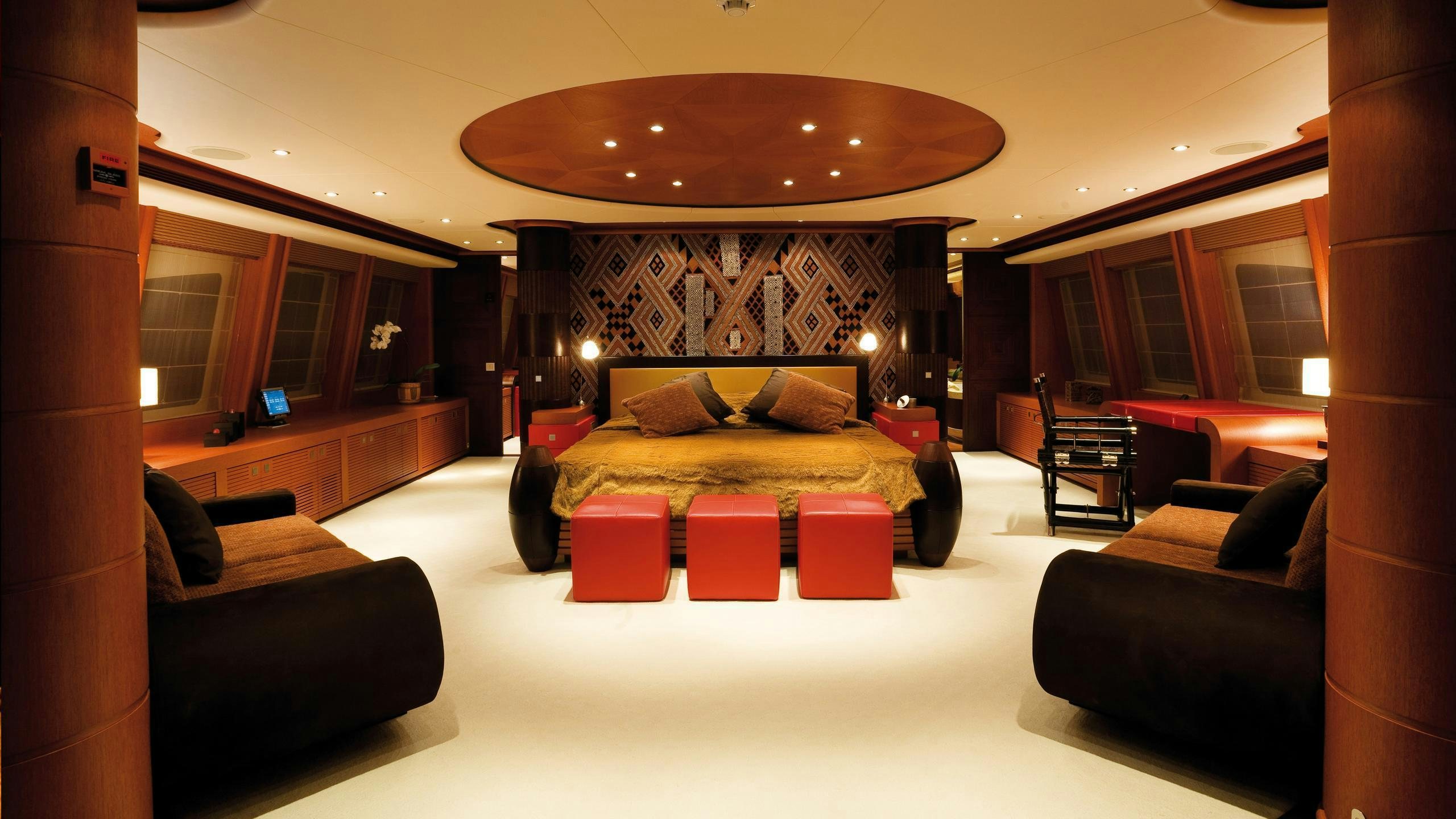 a large room with a couch and a table aboard SIROCCO Yacht for Charter