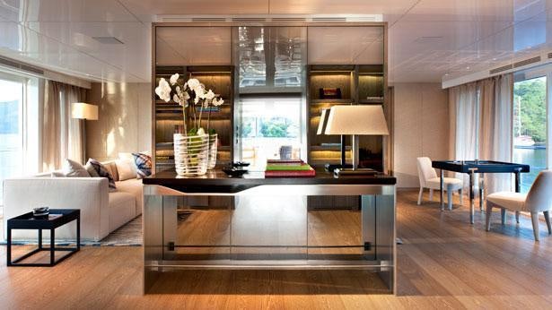 a living room with a large table aboard ORIENT STAR Yacht for Charter