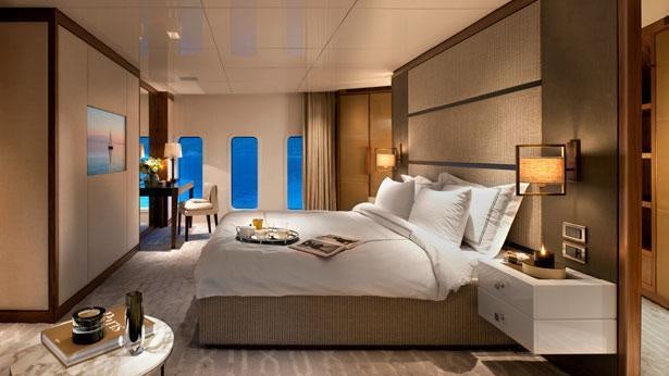 a room with a bed and a table aboard ORIENT STAR Yacht for Charter