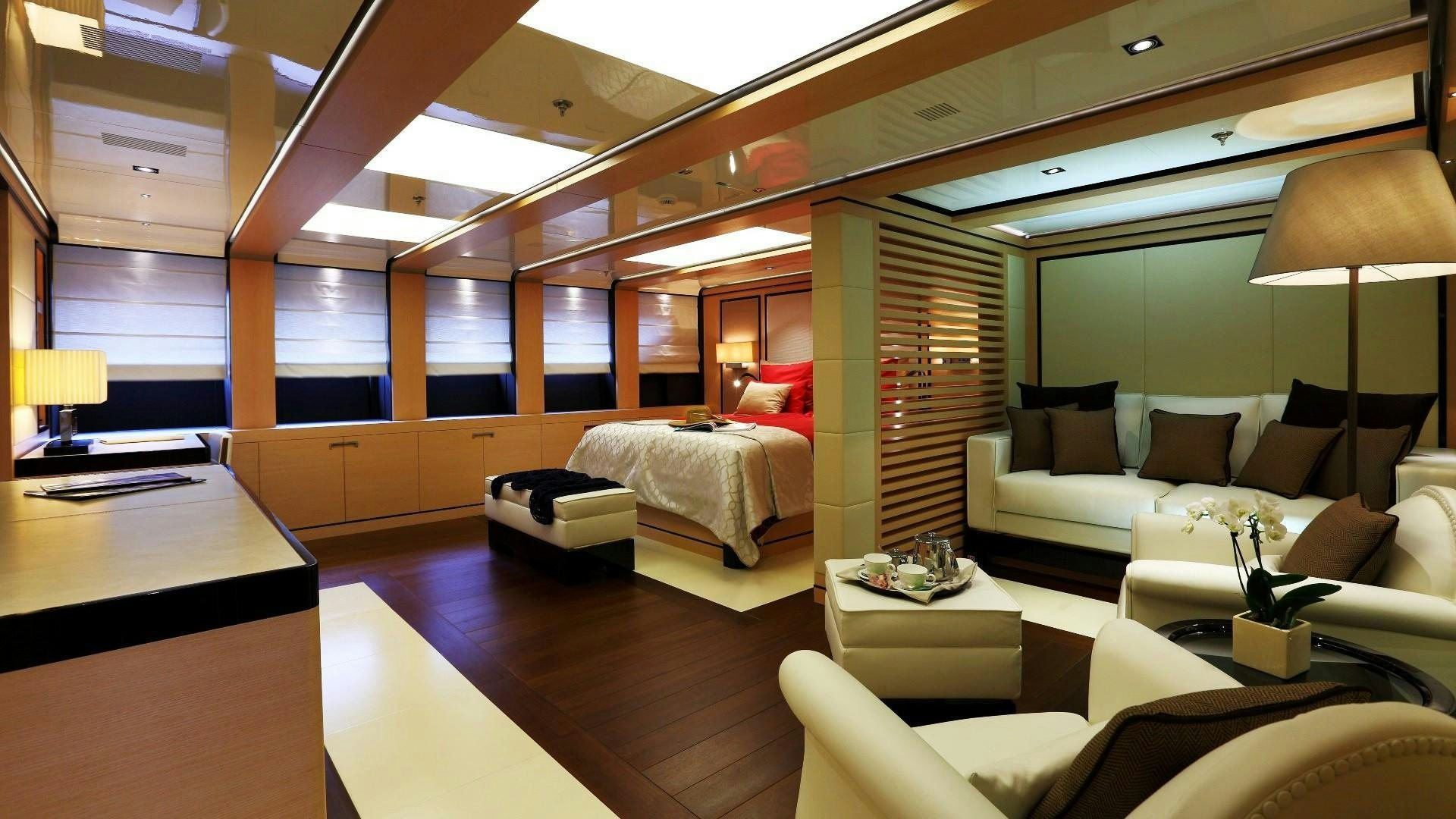 a living room with a large window aboard 2 LADIES Yacht for Charter