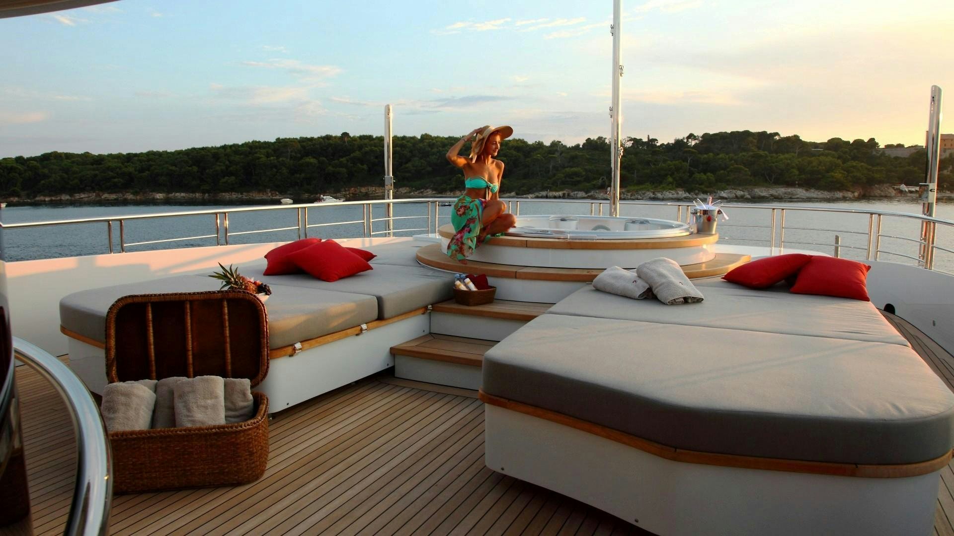 a person sitting on a boat aboard 2 LADIES Yacht for Charter