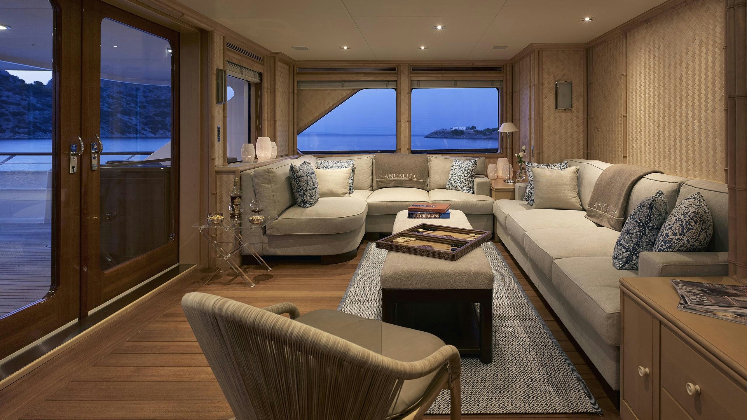 a living room with a couch and a table aboard ANCALLIA Yacht for Charter