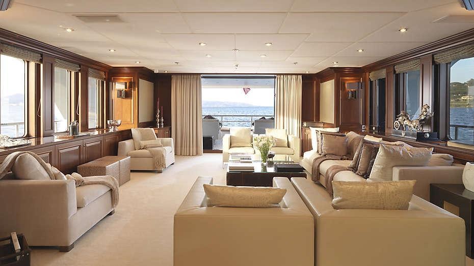 a living room with a large window aboard MY LITTLE VIOLET Yacht for Charter