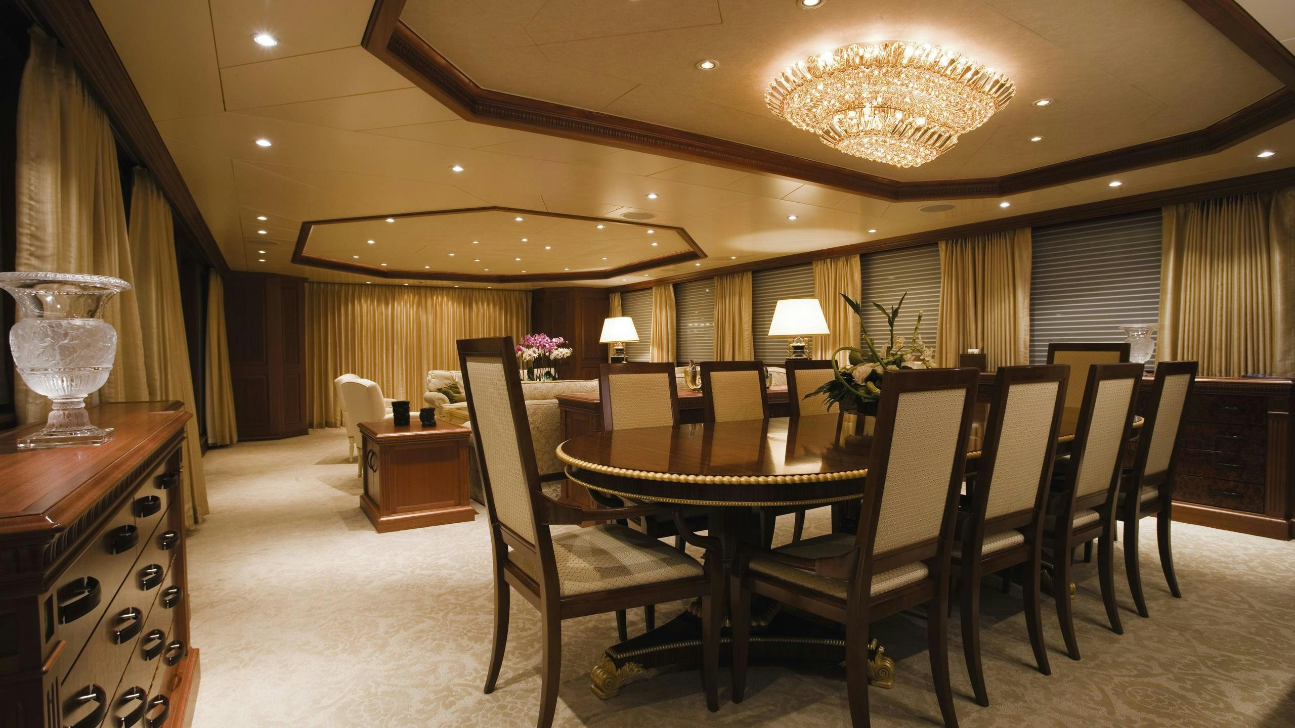 a large room with a table and chairs aboard CROSSED SABRE Yacht for Charter