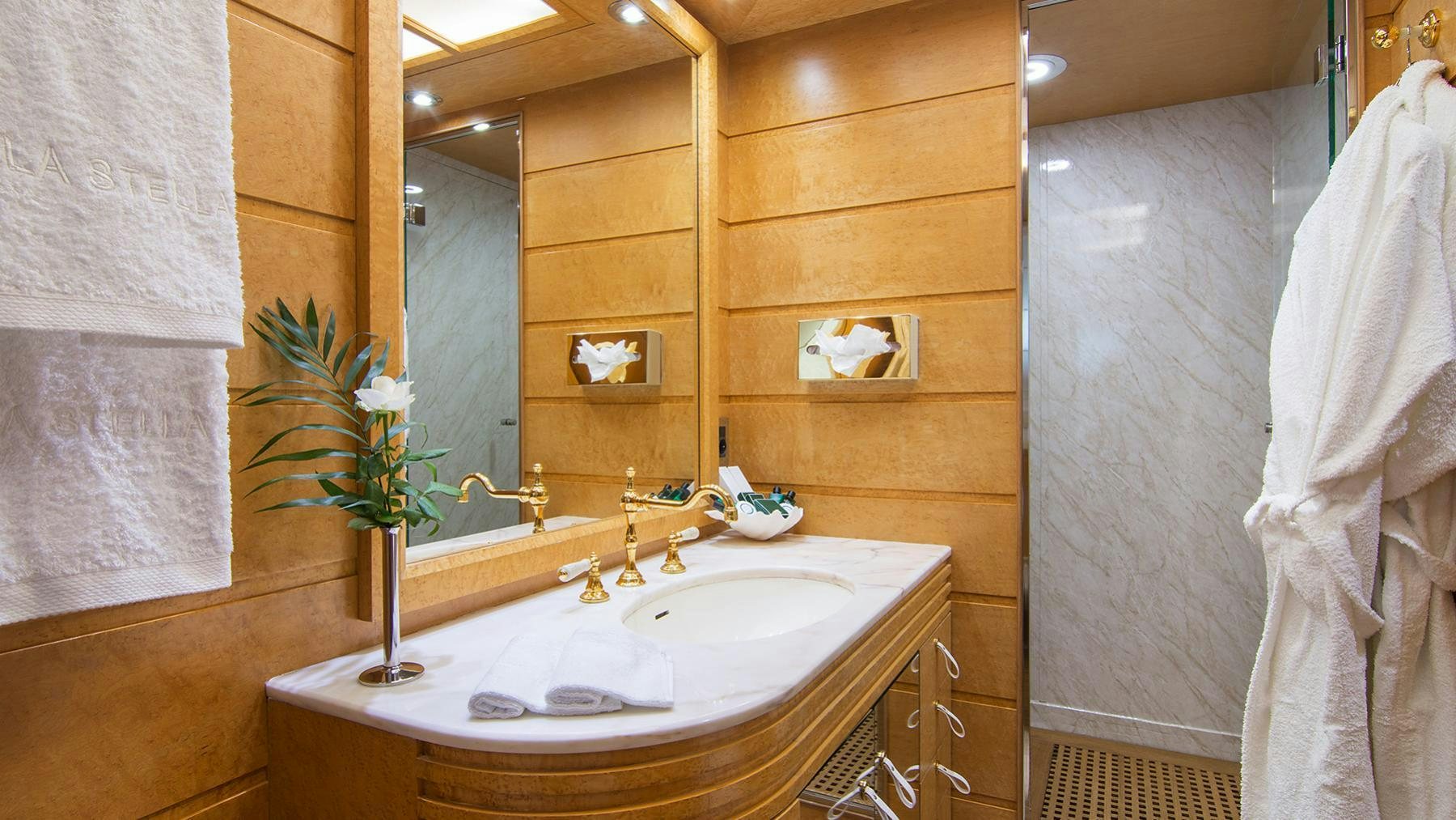 a bathroom with a sink and towels aboard BELLA STELLA Yacht for Charter