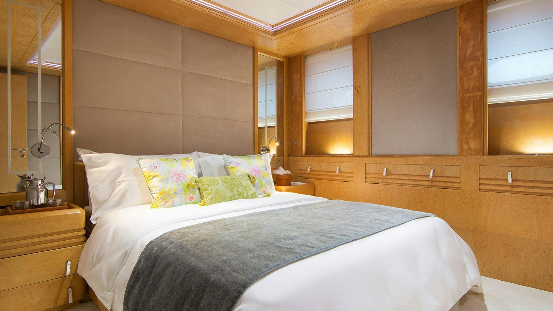 a room with a bed and a mirror aboard BELLA STELLA Yacht for Charter