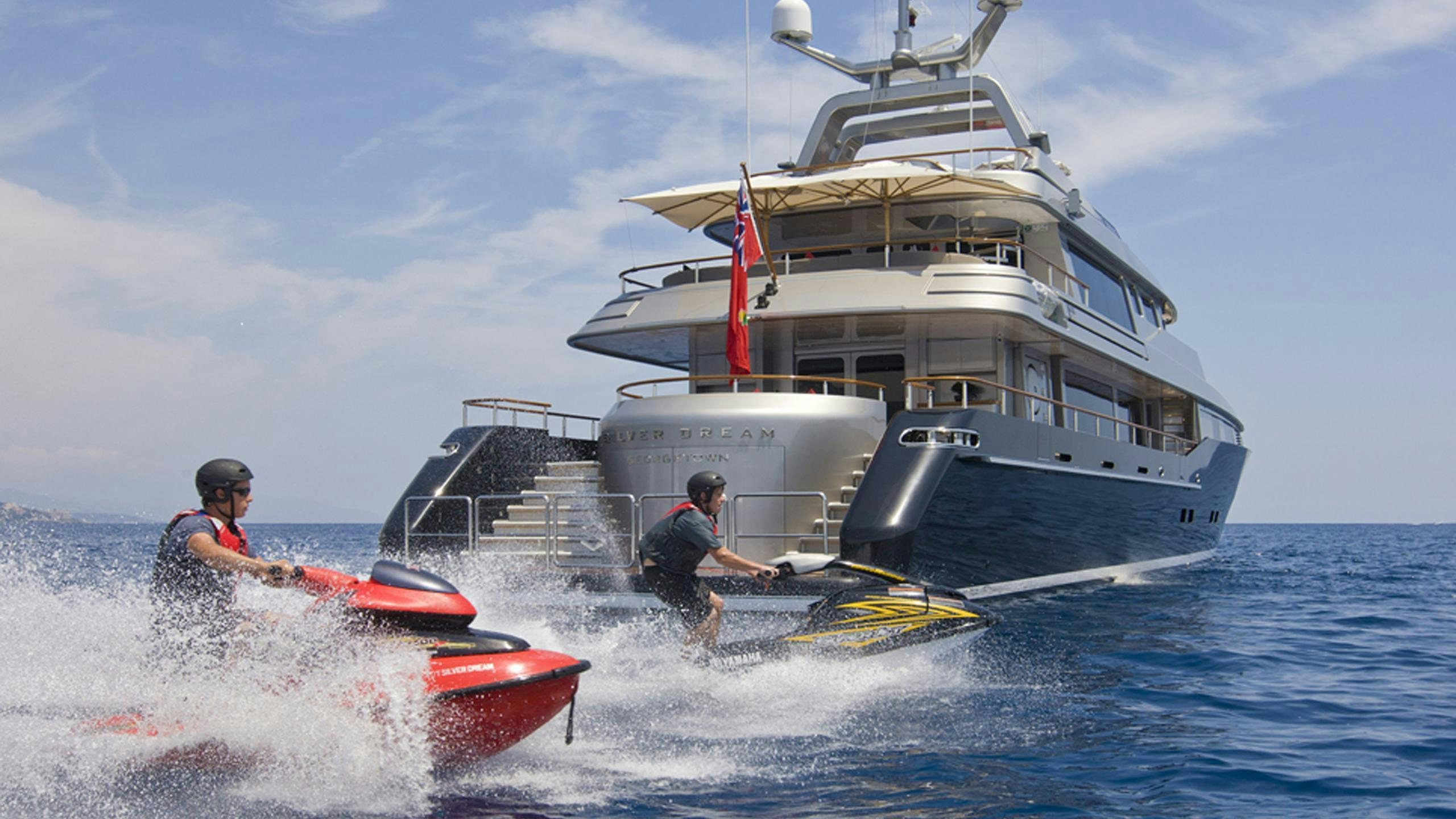 a boat with a person on it aboard SILVER DREAM Yacht for Charter