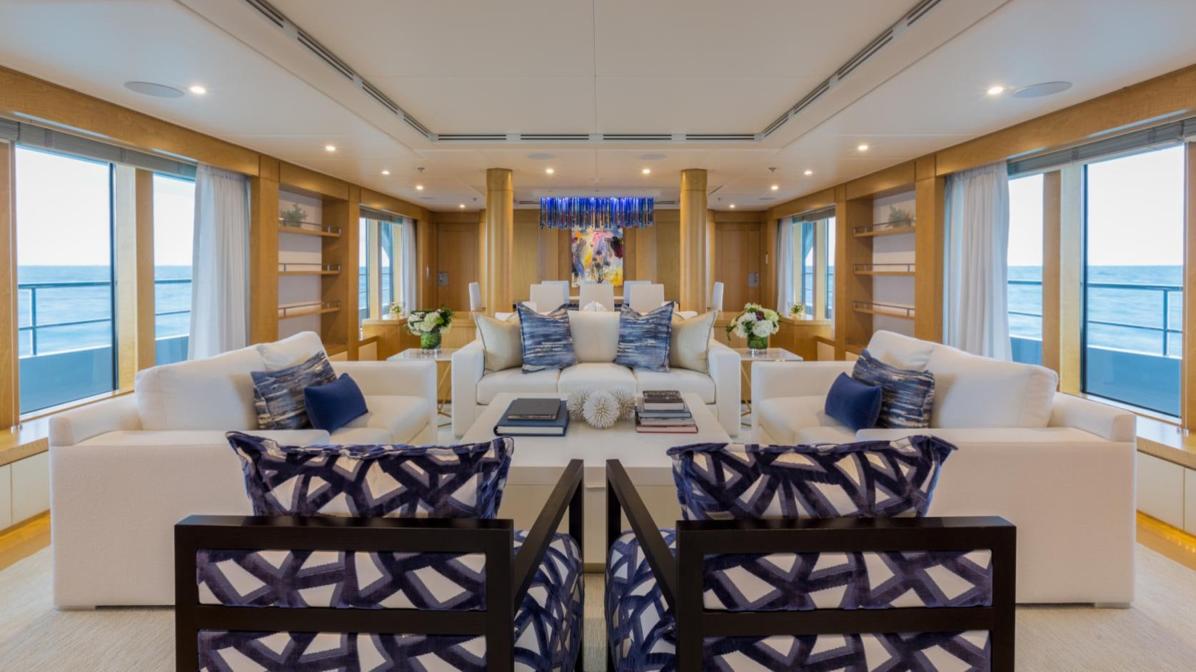 a living room with a couch and a table aboard BACA Yacht for Charter
