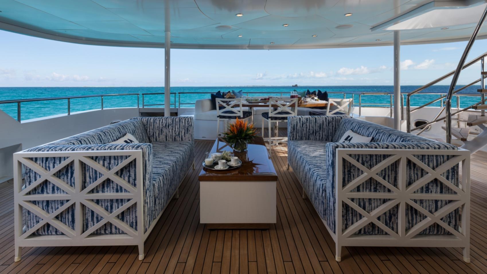 a room with a bed and a table aboard BACA Yacht for Charter