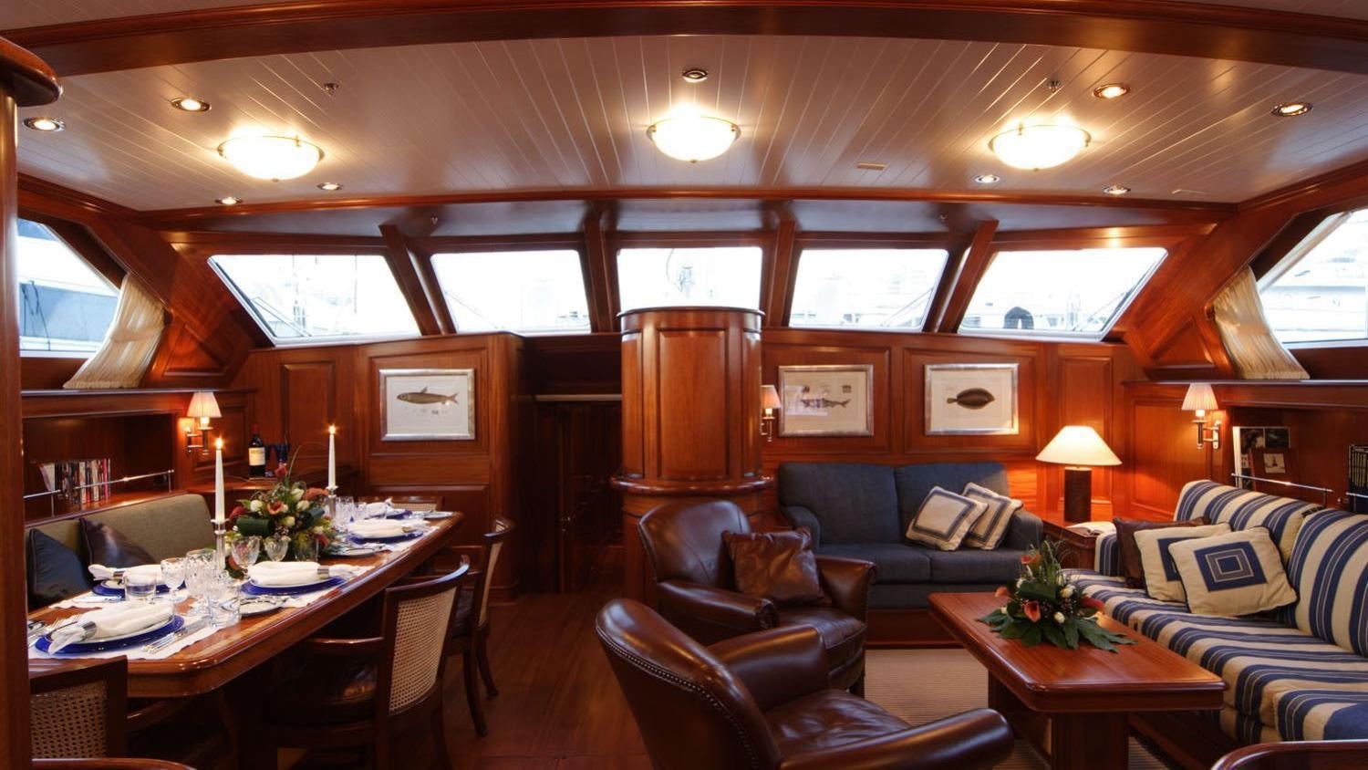 a living room with a couch and a table aboard CAVALLO Yacht for Charter