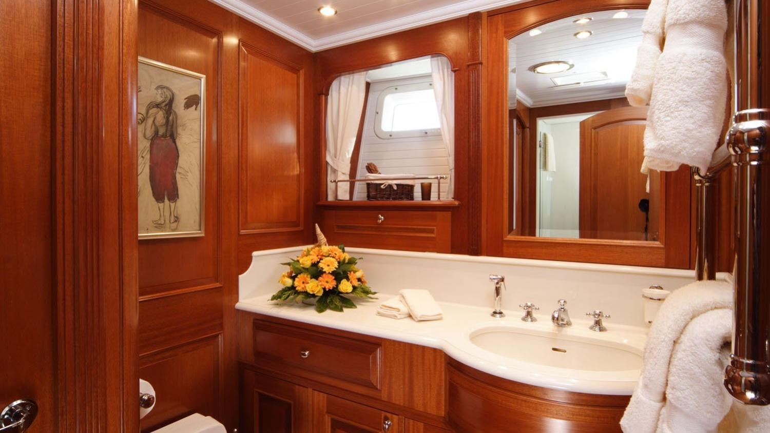 a bathroom with a sink and mirror aboard CAVALLO Yacht for Charter